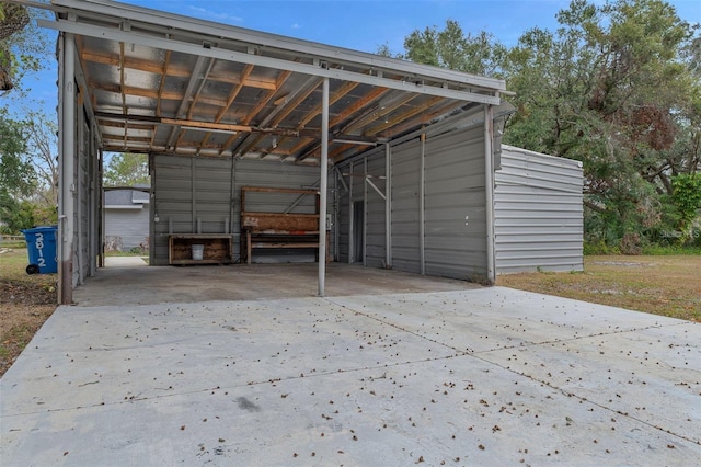 2812 Tom Brewer Ln, Plant City, FL 33566 - garage with concrete driveway and a detached carport