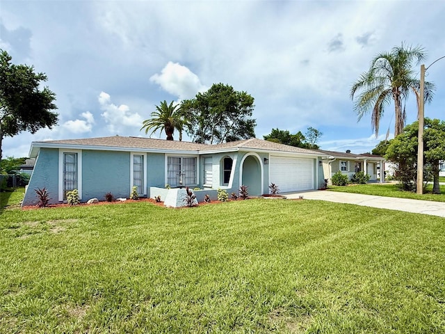 7314 Ivanhoe Dr, Port Richey, FL 34668 - ranch-style home featuring an attached garage, stucco siding, and a front yard
