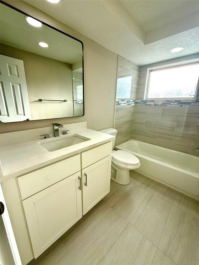 7314 Ivanhoe Dr, Port Richey, FL 34668 - bathroom with vanity, a textured ceiling, and recessed lighting