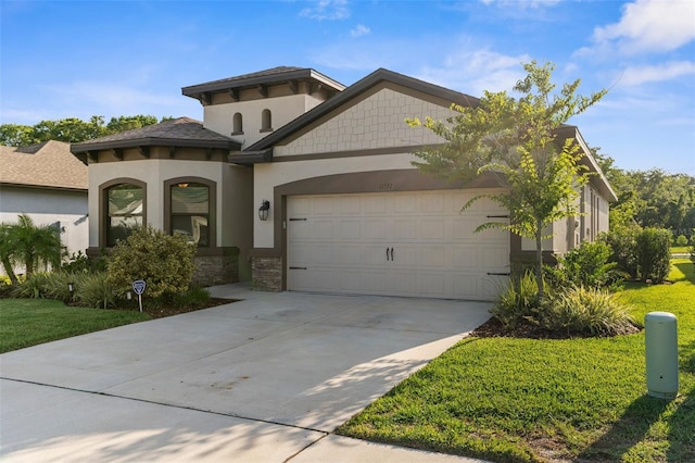 11597 Weaver Hollow Rd, New Port Richey, FL 34654 - mediterranean / spanish house featuring an attached garage, stone siding, concrete driveway, stucco siding, and a front yard