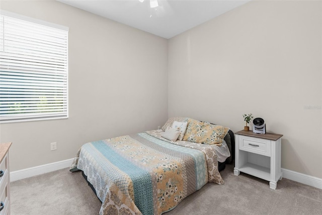11597 Weaver Hollow Rd, New Port Richey, FL 34654 - bedroom with light colored carpet and ceiling fan
