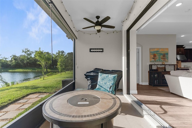 11597 Weaver Hollow Rd, New Port Richey, FL 34654 - sunroom / solarium with a ceiling fan and a water view