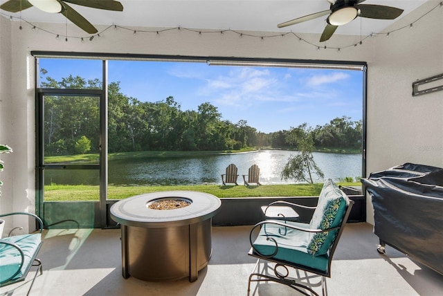 11597 Weaver Hollow Rd, New Port Richey, FL 34654 - sunroom / solarium featuring a ceiling fan and a fire pit