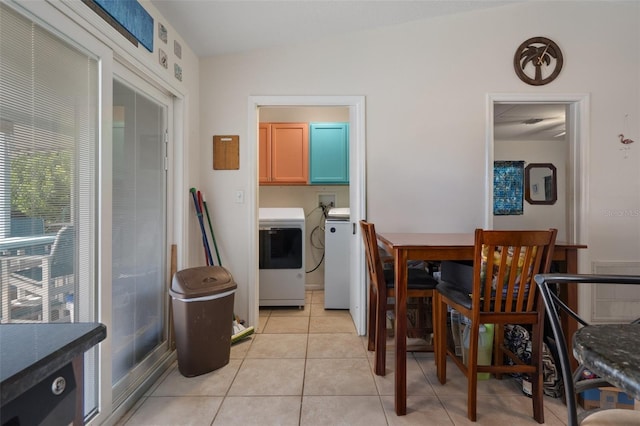3243 Azalea Dr, Hernando Beach, FL 34607 - dining area with washing machine and clothes dryer and light tile patterned floors