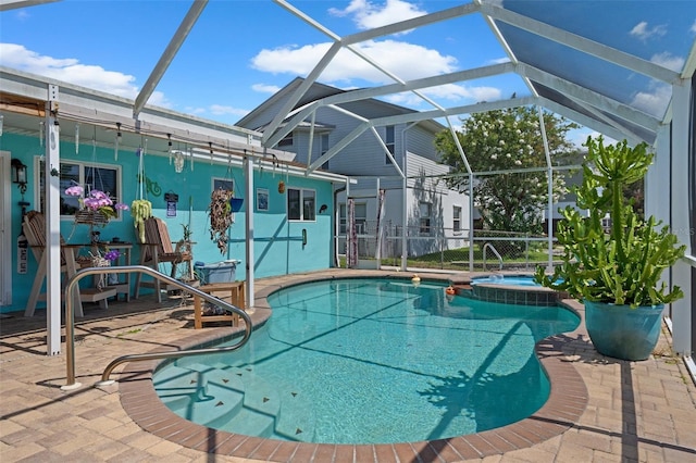 3243 Azalea Dr, Hernando Beach, FL 34607 - view of swimming pool featuring a pool with connected hot tub, a patio area, and a lanai
