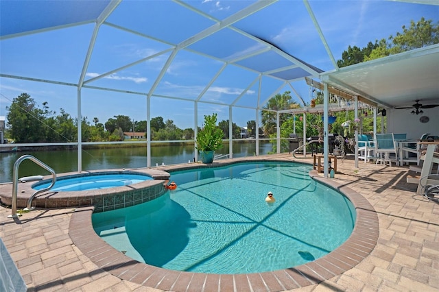 3243 Azalea Dr, Hernando Beach, FL 34607 - view of pool with a patio, a pool with connected hot tub, ceiling fan, a water view, and a lanai