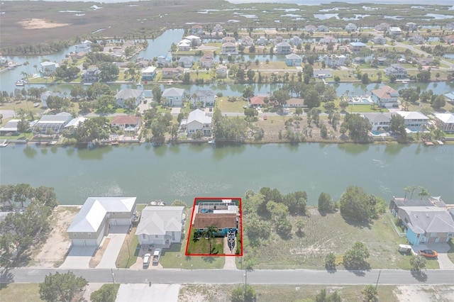 3243 Azalea Dr, Hernando Beach, FL 34607 - aerial perspective of suburban area featuring a large body of water and property parcel outlined