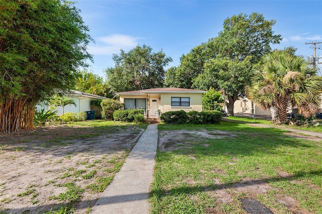 3622 W Mullen Ave, Tampa, FL 33609 - view of front of property with a front lawn and stucco siding