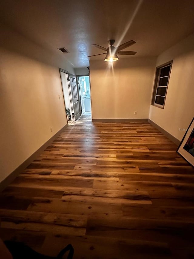 5950 Edison St, Cocoa, FL 32927 - spare room featuring a ceiling fan and dark wood-style flooring