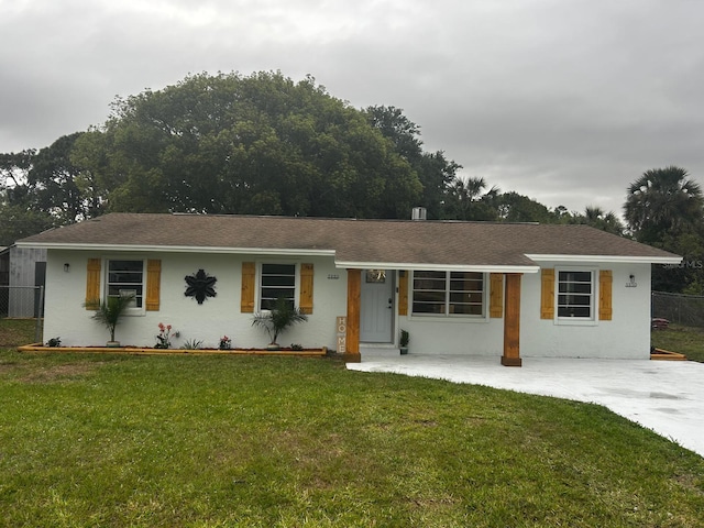 5950 Edison St, Cocoa, FL 32927 - ranch-style home featuring stucco siding and roof with shingles