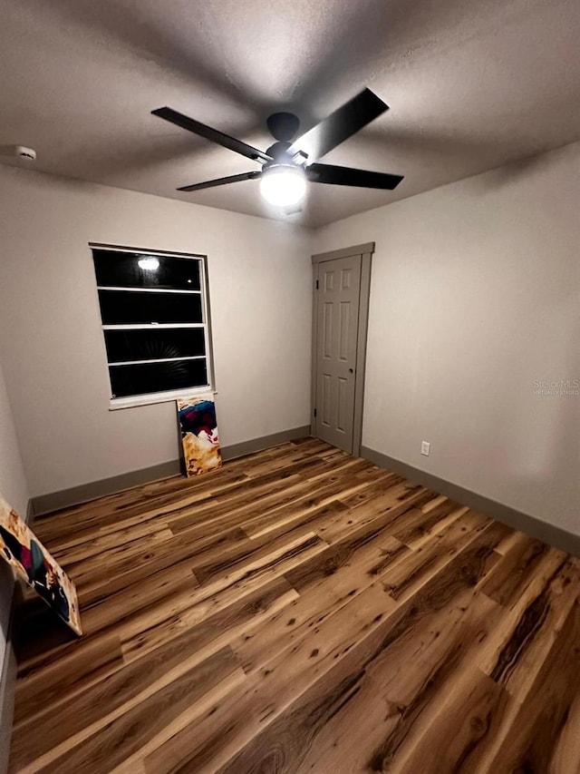 5950 Edison St, Cocoa, FL 32927 - unfurnished bedroom featuring wood finished floors and ceiling fan