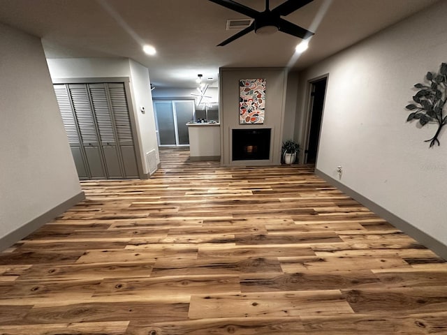 5950 Edison St, Cocoa, FL 32927 - unfurnished living room featuring wood finished floors, ceiling fan, and recessed lighting