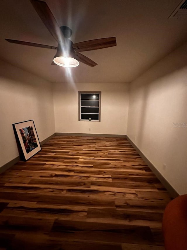 5950 Edison St, Cocoa, FL 32927 - empty room with a ceiling fan and dark wood-type flooring