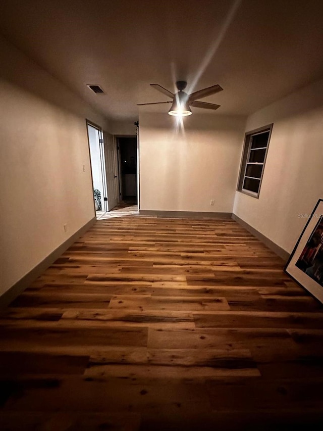 5950 Edison St, Cocoa, FL 32927 - empty room with ceiling fan and wood finished floors