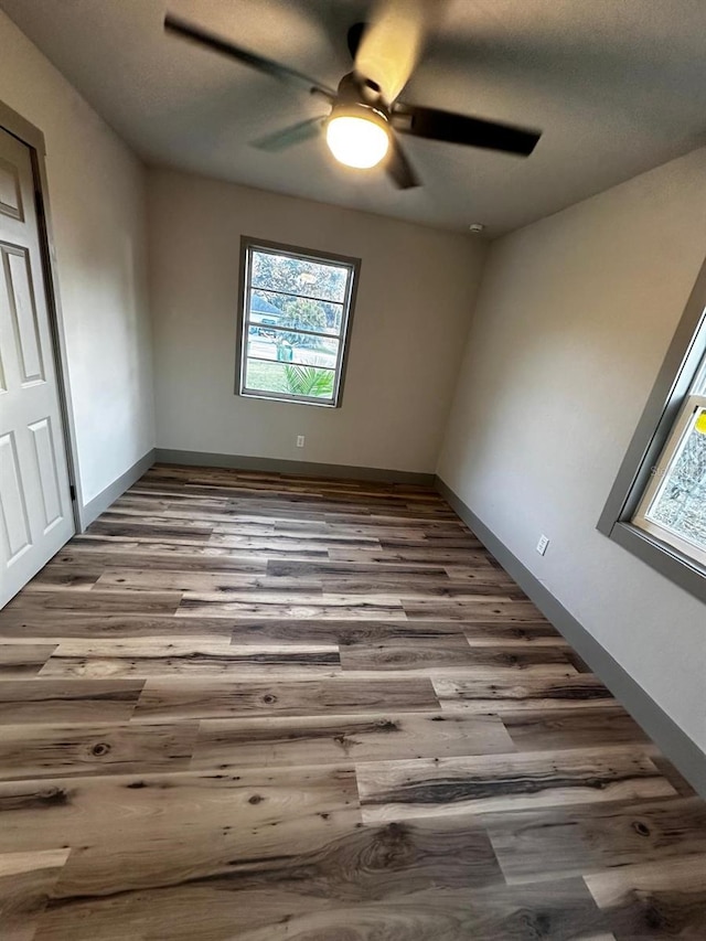 5950 Edison St, Cocoa, FL 32927 - spare room featuring healthy amount of natural light, wood finished floors, and ceiling fan