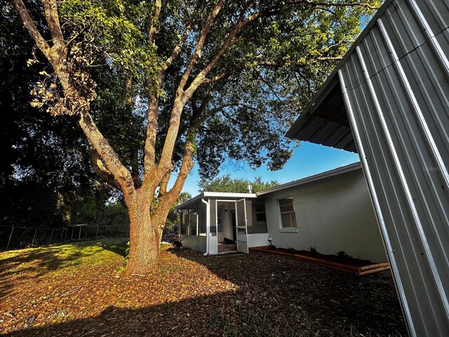 5950 Edison St, Cocoa, FL 32927 - view of yard featuring a sunroom