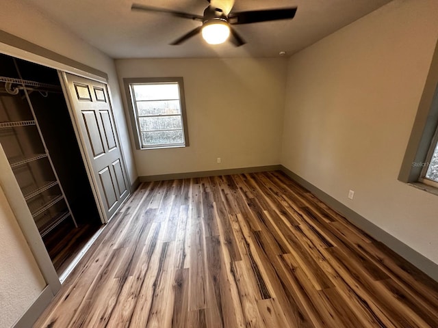 5950 Edison St, Cocoa, FL 32927 - unfurnished bedroom with wood finished floors, a closet, and ceiling fan