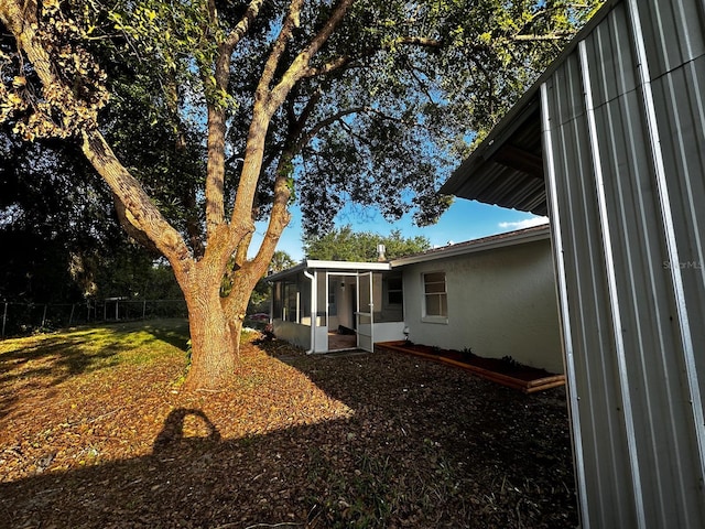 5950 Edison St, Cocoa, FL 32927 - view of yard with a sunroom