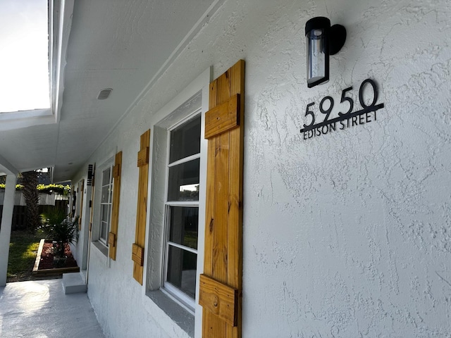 5950 Edison St, Cocoa, FL 32927 - view of exterior entry with stucco siding