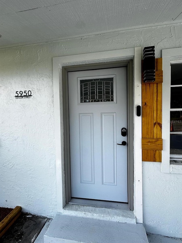 5950 Edison St, Cocoa, FL 32927 - property entrance with stucco siding