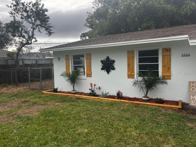 5950 Edison St, Cocoa, FL 32927 - view of property exterior with stucco siding