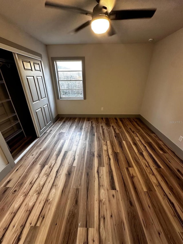 5950 Edison St, Cocoa, FL 32927 - unfurnished bedroom with wood finished floors, ceiling fan, and a closet