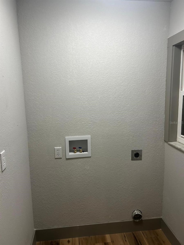 5950 Edison St, Cocoa, FL 32927 - washroom featuring hookup for an electric dryer, washer hookup, and dark wood-type flooring
