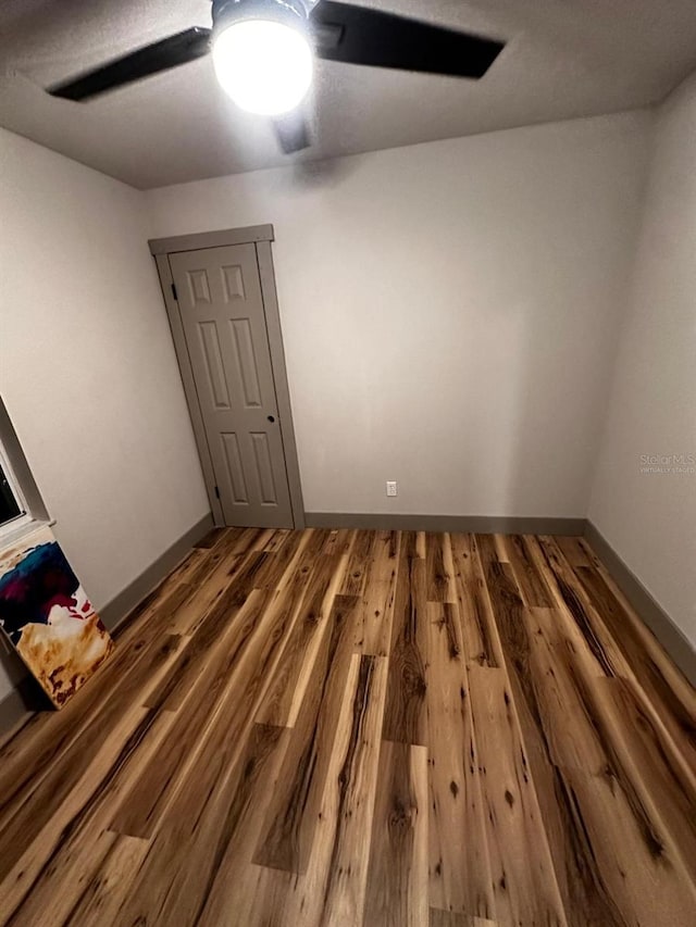 5950 Edison St, Cocoa, FL 32927 - unfurnished bedroom with wood finished floors and ceiling fan