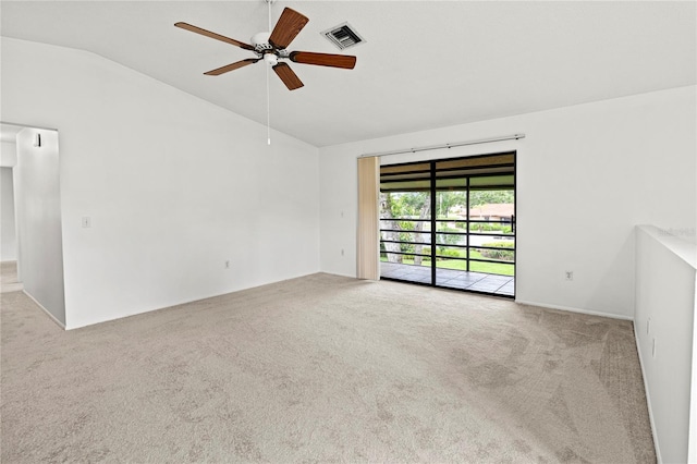 5785 Gardens Dr, Sarasota, FL 34243 - empty room with lofted ceiling, carpet, and a ceiling fan