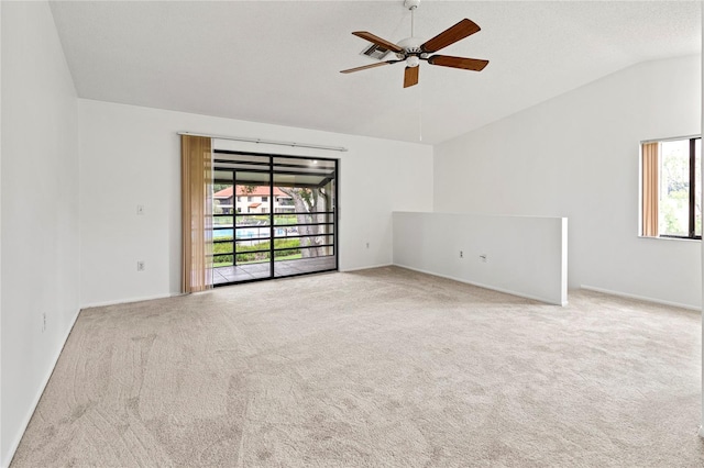 5785 Gardens Dr, Sarasota, FL 34243 - unfurnished room with lofted ceiling, a ceiling fan, and carpet floors