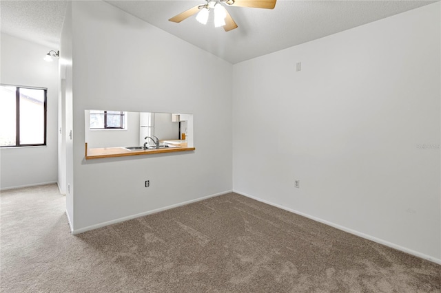 5785 Gardens Dr, Sarasota, FL 34243 - empty room with carpet and ceiling fan