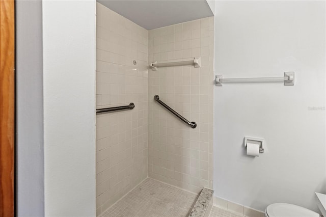 5785 Gardens Dr, Sarasota, FL 34243 - bathroom featuring a tile shower and tile patterned floors