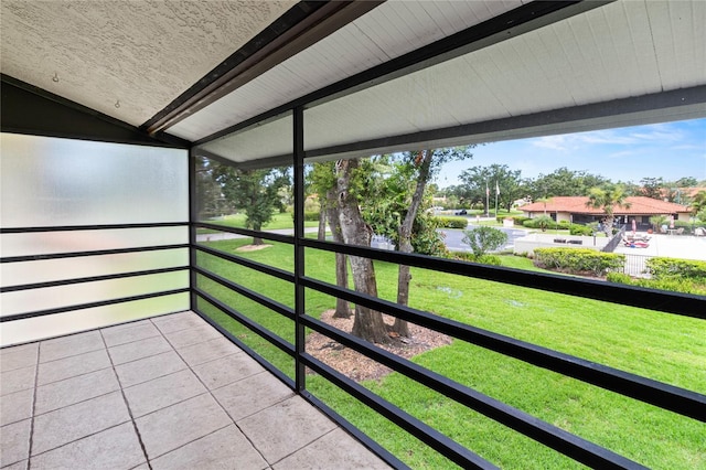 5785 Gardens Dr, Sarasota, FL 34243 - unfurnished sunroom featuring lofted ceiling