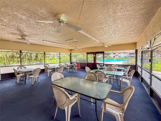 5785 Gardens Dr, Sarasota, FL 34243 - sunroom / solarium featuring outdoor dining area and ceiling fan