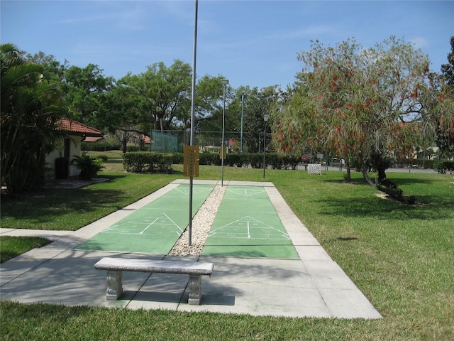 5785 Gardens Dr, Sarasota, FL 34243 - view of home's community featuring shuffleboard