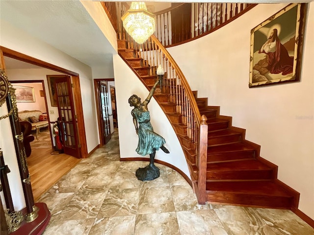 8834 Whispering Oaks Trl, New Port Richey, FL 34654 - stairs featuring baseboards and stone finish floors