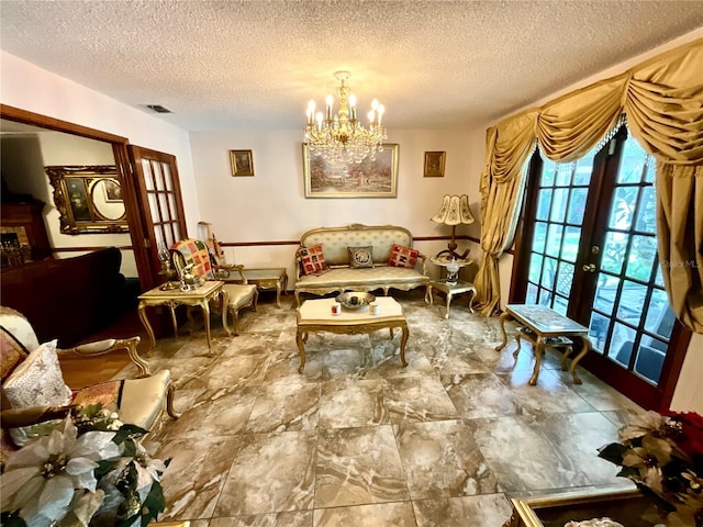 8834 Whispering Oaks Trl, New Port Richey, FL 34654 - living area featuring a chandelier, french doors, and a textured ceiling