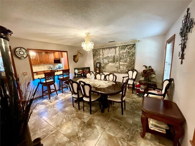 8834 Whispering Oaks Trl, New Port Richey, FL 34654 - dining space featuring a chandelier and a textured ceiling