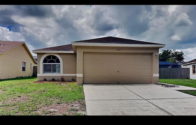 1421 Mohrlake Dr, Brandon, FL 33511 - ranch-style home with stucco siding, driveway, and an attached garage
