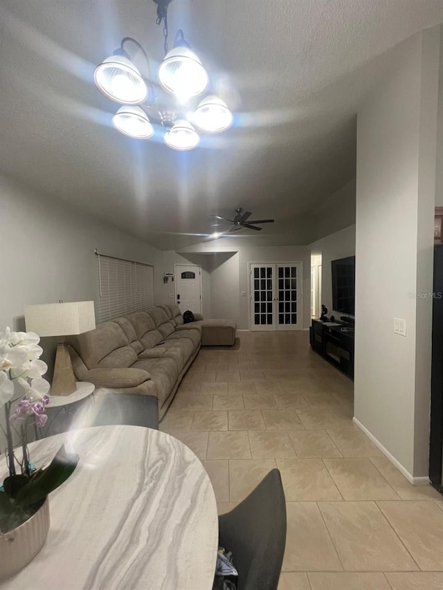 1421 Mohrlake Dr, Brandon, FL 33511 - living room featuring a ceiling fan, light tile patterned flooring, french doors, and a textured ceiling