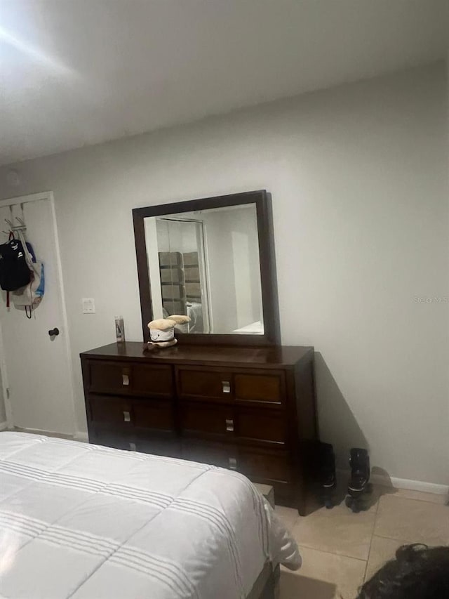 1421 Mohrlake Dr, Brandon, FL 33511 - bedroom featuring tile patterned flooring and baseboards