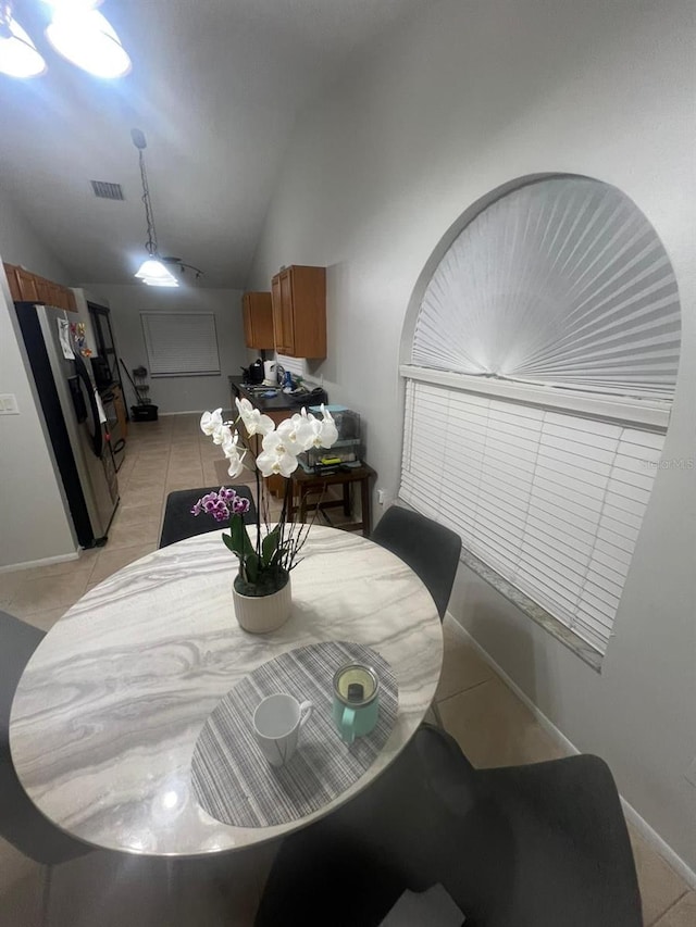 1421 Mohrlake Dr, Brandon, FL 33511 - dining area featuring lofted ceiling and light tile patterned flooring