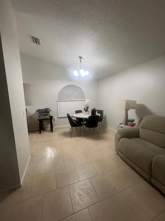 1421 Mohrlake Dr, Brandon, FL 33511 - tiled dining room with a chandelier and a textured ceiling