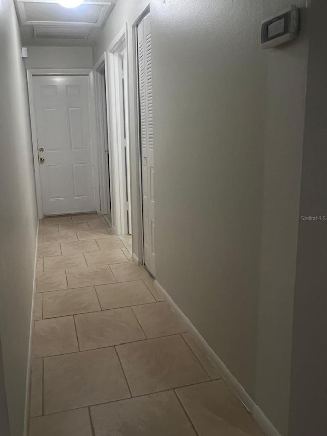 1421 Mohrlake Dr, Brandon, FL 33511 - hall with attic access and light tile patterned floors