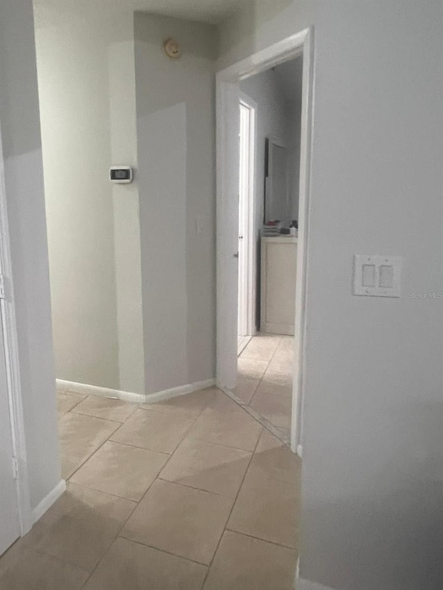1421 Mohrlake Dr, Brandon, FL 33511 - corridor featuring light tile patterned flooring and baseboards