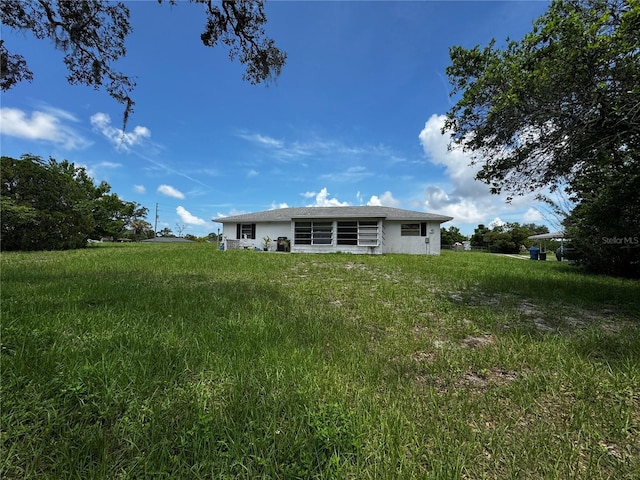 1106 Trellis Ave, Spring Hill, FL 34606 - rear view of house with stucco siding