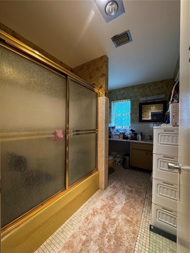 1106 Trellis Ave, Spring Hill, FL 34606 - bathroom with tile patterned flooring, vanity, and enclosed tub / shower combo