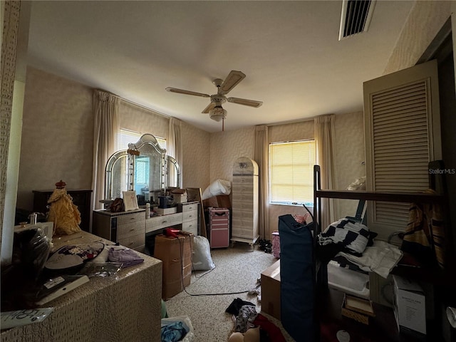 1106 Trellis Ave, Spring Hill, FL 34606 - carpeted bedroom with wallpapered walls, multiple windows, and a ceiling fan