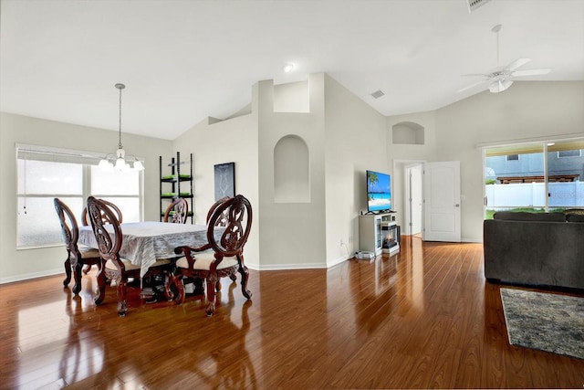18419 Merseyside Loop, Land O Lakes, FL 34638 - dining area featuring wood finished floors, a ceiling fan, a chandelier, and high vaulted ceiling