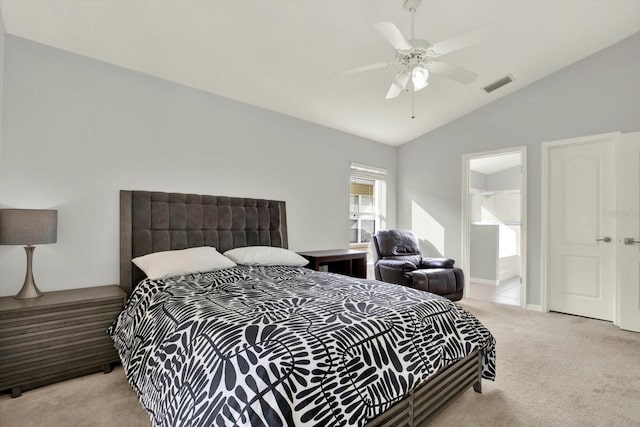 18419 Merseyside Loop, Land O Lakes, FL 34638 - carpeted bedroom with vaulted ceiling, ceiling fan, and ensuite bath
